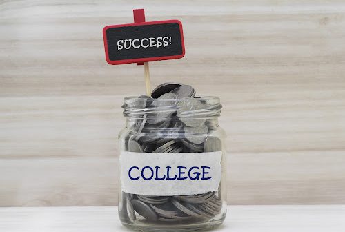 Mason jar filled with coins and a label on the front that reads "College."